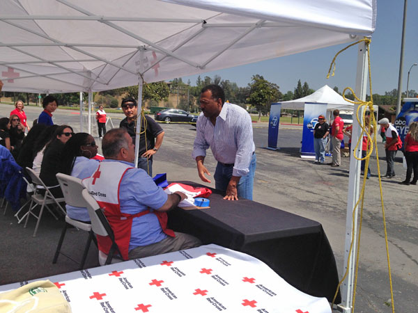 ABC7 Anchor Marc Brown talks with American Red...