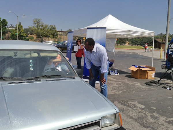 ABC7 Anchor Marc Brown greets a donor at a...