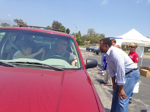 ABC7 Anchor Marc Brown greets two donors at a...