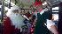 Santa helps Garth the Elf Stuff-A-Bus in...