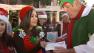 Representatives with IAC Industries donated toys and gave a $500 check to help Garth the Elf Stuff-A-Bus at the Honda Center in Anaheim on Friday, Dec. 21, 2012.