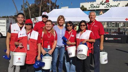Eyewitness News anchor Michelle Tuzee poses with Red Cross volunteers at our ABC7 Relief Drive at the Rose Bowl for victims of Typhoon Haiyan on Wednesday, Nov. 13, 2013.