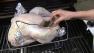 A turkey is cooked on a grill in this undated file photo. Grilling your turkey is an easy option for Thanksgiving.