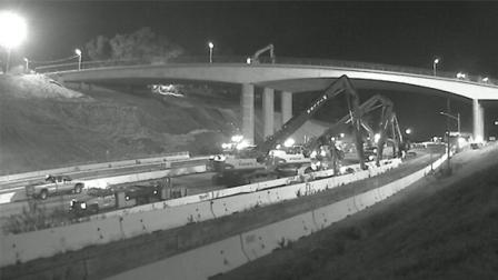 Construction crews begin work on taking apart  the south side of the Mulholland Bridge after the 405 Freeway  closed at midnight on July 16, 2011.