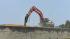 Heavy machinery was brought in to take down the...