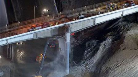 Crews continue to work on the Mulholland Bridge Saturday night to stay on schedule for the 405 Freeway project.