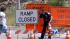 A Los Angeles Police Department officer removes...