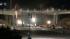 Sparks are seen as crews work on demolishing the...