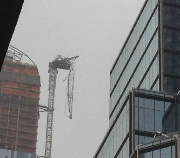 A crane is seen dangling on 57th Street and 7th...