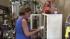 A woman cleans her store after a 4.1-magnitude earthquake hit the Yorba Linda area on Wednesday, Aug. 29, 2012.