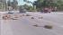 Drivers are seen dodging fallen palm tree branches in Mission Hills on Friday, Oct. 26, 2012.