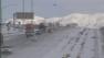 Cars are seen on the Cajon Pass on a snowy day on Feb. 20, 2013.