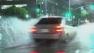 A driver is seen on a rain-slick road in downtown Los Angeles on Monday, May 6, 2013.