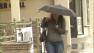 A woman walks on a rainy day in the Los Angeles area on Monday, April 6, 2013.