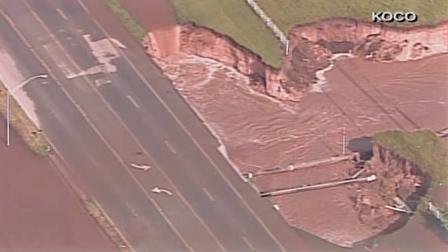 A massive sinkhole opened up along a road in Oklahoma City after multiple tornadoes stuck the area on Friday, May 31, 2013.