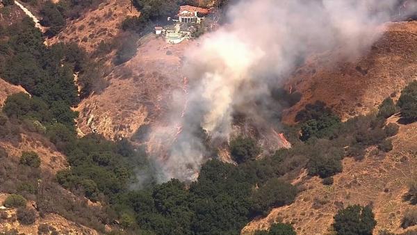 A brush fire burning near Broken Spur Lane and Rough Rider Road in La Verne prompted evacuations Friday afternoon.