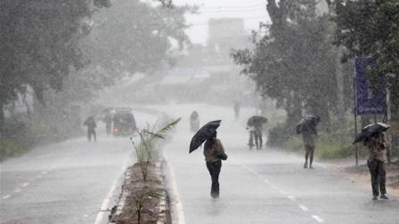 Indians hold umbrellas as they head to a cyclone shelter in Chatrapur in Ganjam district, about 200 kilometers (125 miles) from the eastern Indian city Bhubaneswar, India, Saturday, Oct. 12, 2013.
