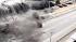 Tsunami crashes over sea wall north of Tokyo :: People caught a tsunami on video as it crashed over a sea wall north of Tokyo, taking out vehicles and thrashing boats.