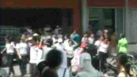 People run out of a building following a powerful 6.6-magnitude earthquake in Indonesia on Saturday, April 21, 2012.