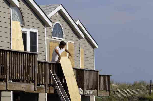 Justin Curcio, a carpenter from Buxton, boards...