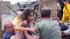 A child is pulled from the rubble of the Plaza Towers Elementary School in Moore, Okla., and passed along to rescuers Monday, May 20, 2013.
