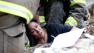 A woman is pulled out from under tornado debris at the Plaza Towers School in Moore, Okla., Monday, May 20, 2013.