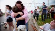 Families reunite following a tornado that struck Moore, Okla., on Monday, May 20, 2013.
