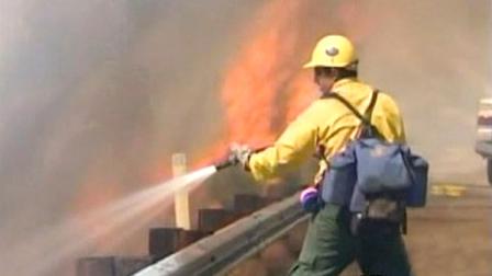Firefighters in Kern County battle a wind-driven wildfire that threatened hundreds of homes and prompted evacuations near Lake Isabella.