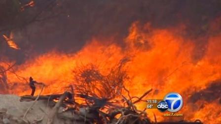 Wildfires sparked by lightning strikes burned Sunday, Sept. 11, 2011, near homes in areas of Central California.