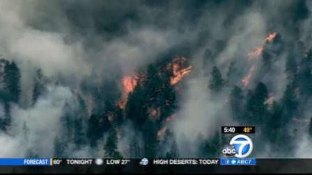 A wildfire burns about 25 miles southwest of Denver, Colo. in this March photo.