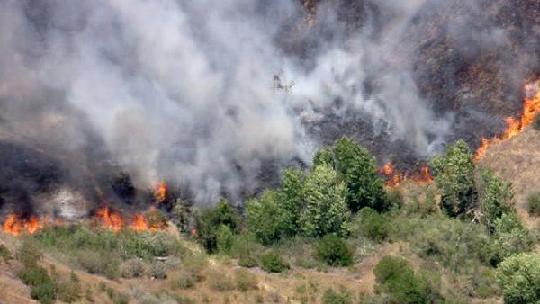 Smoke rises above the hills of Castaic, where a brush fire broke out along Interstate 5 on Friday, June 8, 2012. Fanned by winds, the blaze grew from 3 acres to more than 50 in less than three hours.