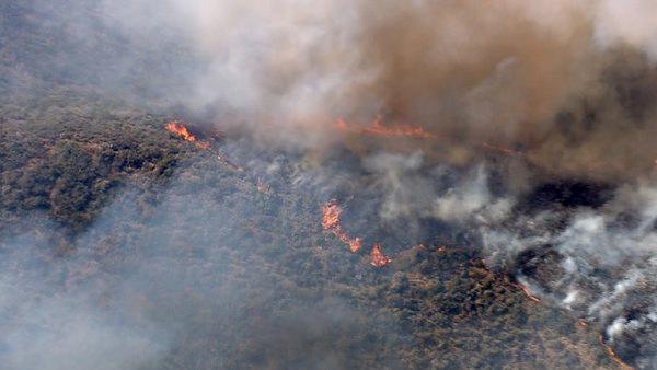Smoke rises above the hills of Castaic, where a brush fire broke out along Interstate 5 on Friday, June 8, 2012. Fanned by winds, the blaze grew from 3 acres to more than 50 in less than three hours.
