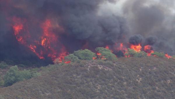 A brush fire burned in rural Murrieta on Wednesday, Aug. 1, 2012.