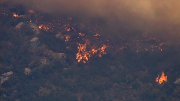 A large brush fire burns in Aguanga, just east of Temecula, on Tuesday, Aug. 14, 2012. Several homes were evacuated and some structures were damaged.