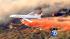 An air tanker makes a drop on the Buck Fire burning in Aguanga, just east of Temecula, on Tuesday, Aug. 14, 2012.