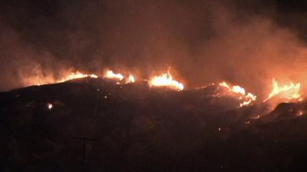 A brush fire burns at Blue Mountain Court and Pico Street in Grand Terrace on Tuesday, Aug. 21, 2012.