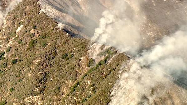 Smoke rises above a wildfire burning in the San Gabriel Mountains above Glendora on Sunday, Sept. 2, 2012. About 1,500 recreationists and residents were evacuated in that part of the wilderness.