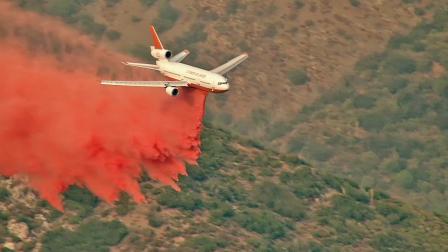 A plane drops fire retardant over the Williams Fire in the Angeles National Forest.