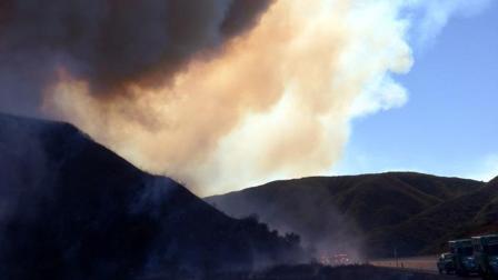 Smoke from a brush fire burning in the Cajon Pass is seen on Monday, Nov. 5, 2012.