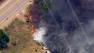Fire crews battle a brush fire in the Lytle Creek area on Monday, May, 13, 2013.