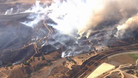 Smoke from a brush fire burning in the Castaic area is seen from AIR7 HD on Friday, May 17, 2013.