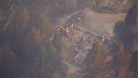 The remains of a structure destroyed by the Powerhouse Fire is seen by AIR7 HD.