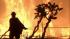 A firefighter battles a wildfire in this undated file photo.