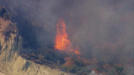 Firefighters were battling a fire near the southbound 5 Freeway and Fort Tejon in the Kern County town of Lebec on Saturday, July 20, 2013.