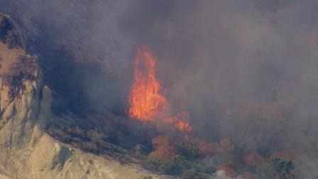 Firefighters were battling a fire near the southbound 5 Freeway and Fort Tejon in the Kern County town of Lebec on Sunday, July 21, 2013.