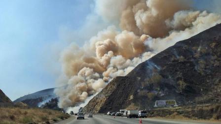 A wildfire burning in Kern County is seen from the 5 Freeway in this photo taken on Tuesday, July 23, 2013.