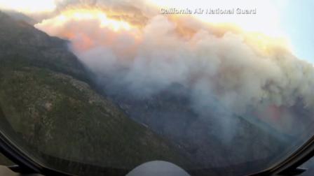 A California National Guard aircraft flies above the Rim Fire on Wednesday, Aug. 28, 2013.