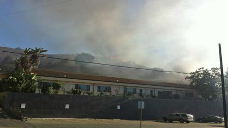 A brush fire burns near 10077 Sunland Boulevard in the Sunland area on Sunday, Sept. 15, 2013.