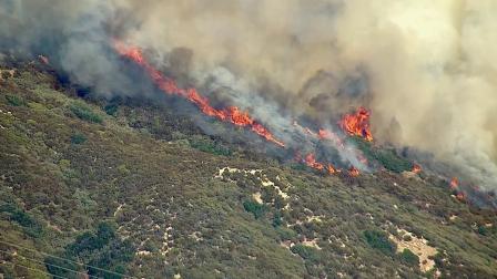 A brush fire broke out west of the 15 Freeway in the Cajon Pass on Tuesday, Sept. 24, 2013.