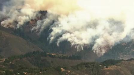 Fire crews work to contain a wildfire burning in Big Sur on Tuesday, Dec. 17, 2013.
